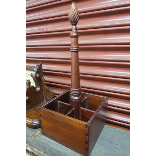 2112 - A mahogany wine carrier of four compartments and a mahogany wall hanging shelf