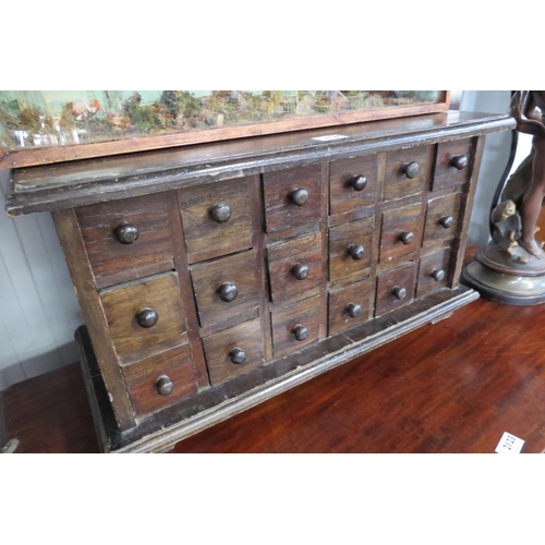 2124 - A bank of eighteen spice drawers