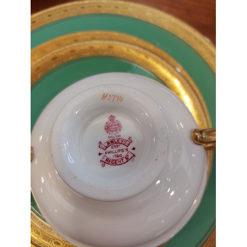 1142 - A twelve place Mintons, (retailed by Lawleys of Regent Street), dinner service white ground with gre... 