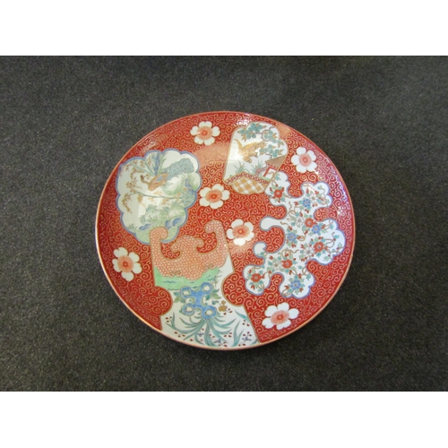 1486 - A Chinese charger in famille rose colour palette, panels of birds and flowers, 46cm diameter    (R) ... 