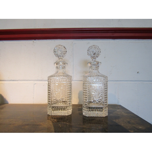 1521 - A pair of lead crystal whisky decanters of square form