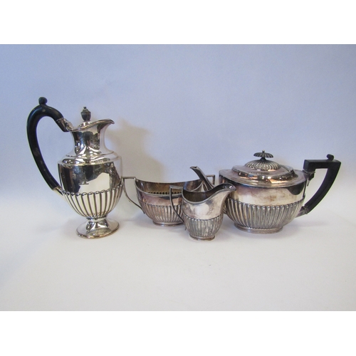 1525 - A three piece EPBM teaset with gadrooned design, ebony knop and handle and a similar coffee pot (4)