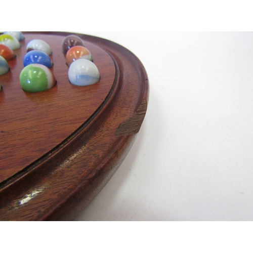 1531 - An Edwardian hardwood solitaire board with marbles, loss to board