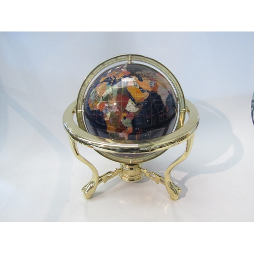 1556 - A gemstone World globe on brass effect gimbal stand