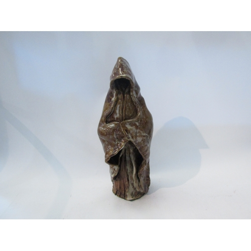 1559 - A Studio pottery caped figure, 38cm tall