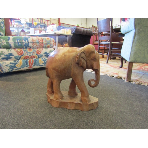 1563 - A wooden elephant figure on base, 37cm tall