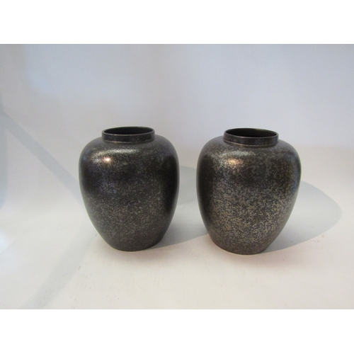 1566 - A pair of Poole pottery black lustre ware baluster form vases, 22cm tall