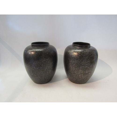 1566 - A pair of Poole pottery black lustre ware baluster form vases, 22cm tall