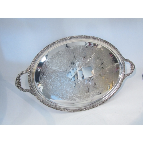 1579 - A plate on copper twin handled oval tray, 67cm long