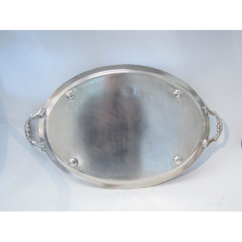 1579 - A plate on copper twin handled oval tray, 67cm long