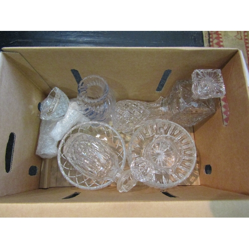 1590 - Two boxes of cut glass crystal including decanters, bowls, vases etc.