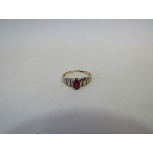 1411 - A 9ct gold ruby and diamond ring. Size O, 2.2g