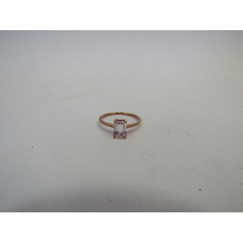 1412 - A 9ct rose gold ring set with an emerald cut pale pink stone. Size Q, 1.7g