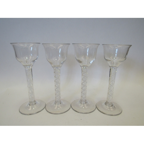 1447 - A set of four Victorian twisted stem glasses, 18.5cm tall, chip to one rim