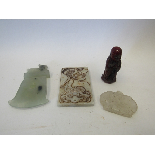 1451 - A piece of jade modelled as a hand tool with Dog of Fo to top, together with two other carved stone ... 