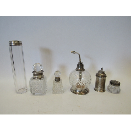 1468 - A cut glass atomiser with sterling silver top, a silver and cut glass scent bottle and two similar a... 