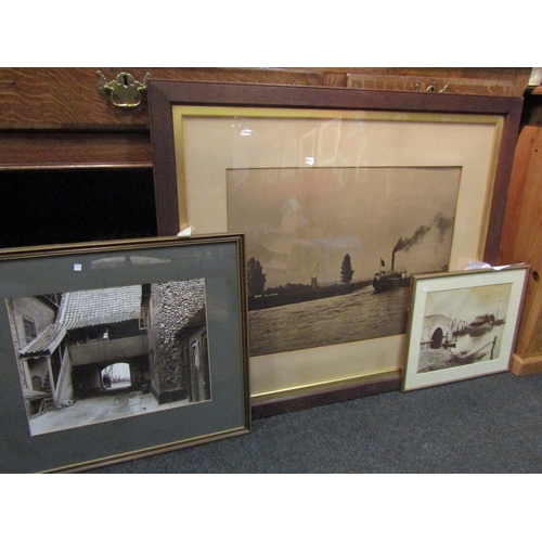 1067 - A large photograph of a boat on the Broads, oak framed and glazed, 43cm x 58cm image size, a photogr... 