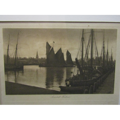 1067 - A large photograph of a boat on the Broads, oak framed and glazed, 43cm x 58cm image size, a photogr... 