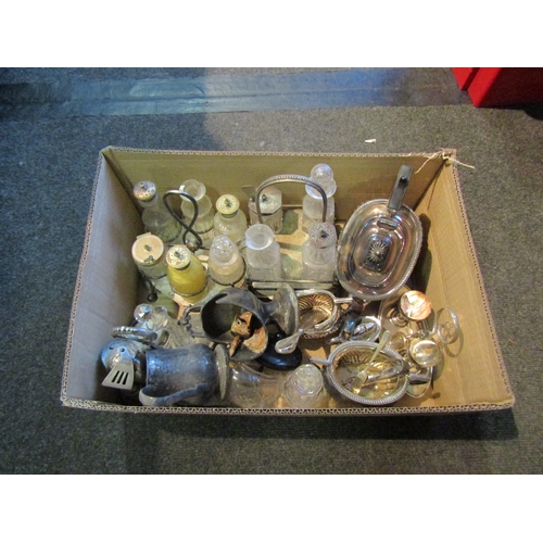 1253 - A box containing a silver plate teapot, cruet sets, egg cups, etc