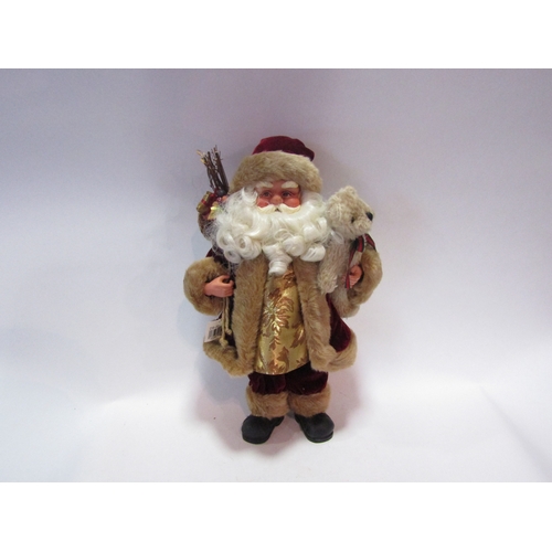 1482 - A figure of Santa with teddy bear and sack