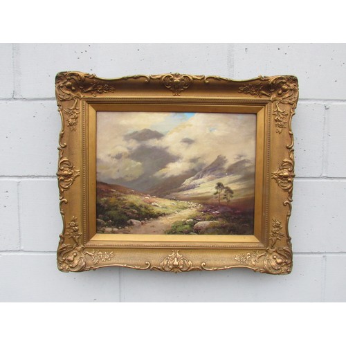 6038 - GEORGE MELVIN RENNIE (1874-1953) A gilt framed Scottish highland scene, sheep on mountain path. Sign... 