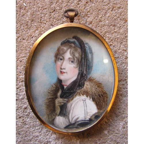 6019 - A 19th Century watercolour on oval ivory panel of a young woman with fur collar. Unsigned. Brassed m... 