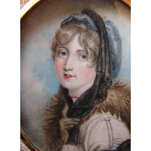 6019 - A 19th Century watercolour on oval ivory panel of a young woman with fur collar. Unsigned. Brassed m... 