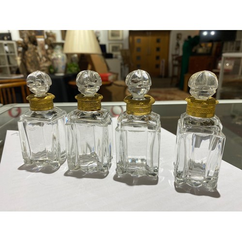 7348 - A 19th Century French scent bottle set, the case with figured hardwood veneer, with applied gilt bra... 