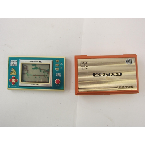 9018 - Two vintage Nintendo Game & Watch handheld electronic games to include DK-52 Donkey Kong and DJ-101 ... 