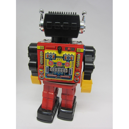 9072 - A boxed SH (Horikawa), Japan, battery operated plastic and tinplate robot with chest opening to reve... 