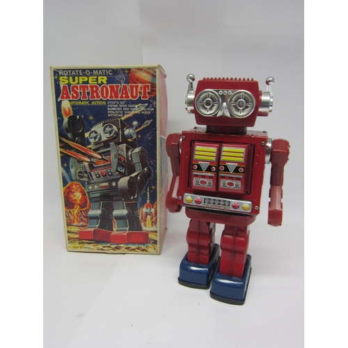 9071 - A boxed SH (Horikawa), Japan, battery operated Rotate-O-Matic Super Astronaut tinplate and plastic r... 