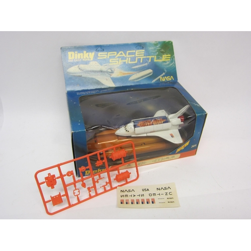 9064 - A Dinky Toys 364 diecast NASA Space Shuttle, with unbuilt plastic satellite, card satellite and unus... 