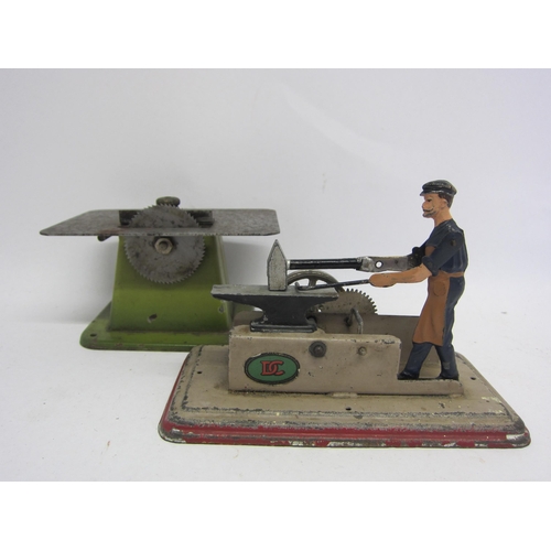 9539 - Two German steam driven accessories to include Doll et Cie cast metal blacksmith with hammer and anv... 