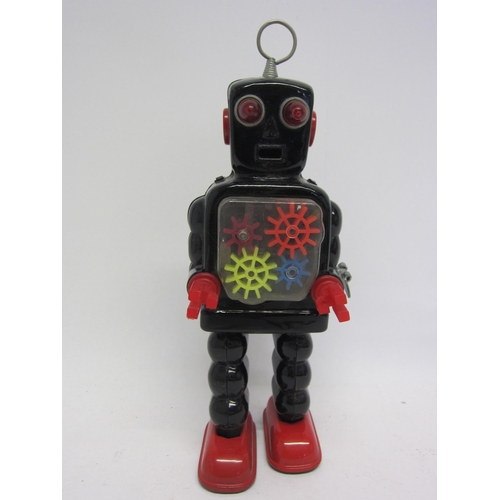 9074 - A KO (Yoshiya), Japan, sparking gear robot with black tinplate body and red feet, red plastic arms, ... 