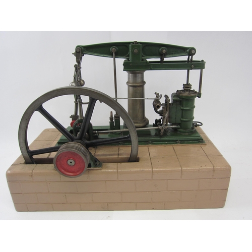 9557 - A well engineered live steam beam engine with single vertical cylinder, valve chest, flywheel (23.5c... 