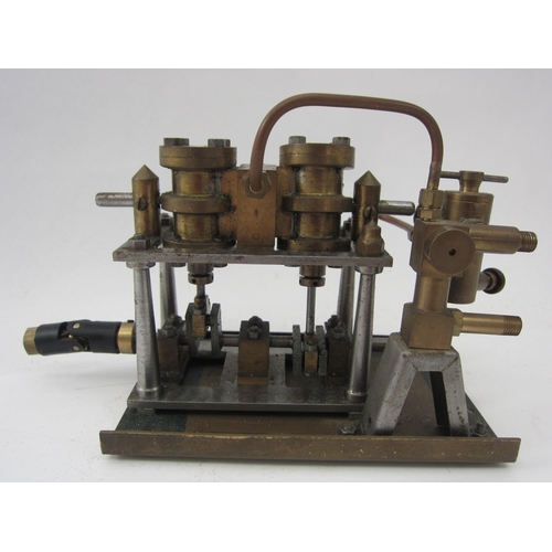 9555 - A live steam twin cylinder oscillating marine engine