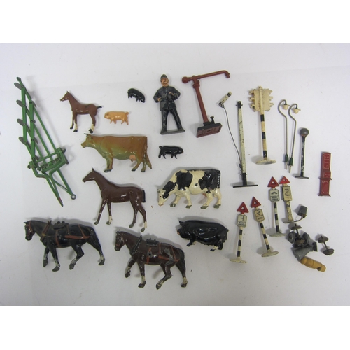 9264 - A small selection of painted lead farm animals including Britain's, Dinky road signs, etc