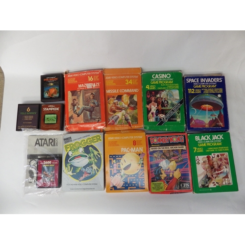 9028 - An Atari 2600 Video Computer System and a collection of Atari games including Mario Bros, Donkey Kon... 