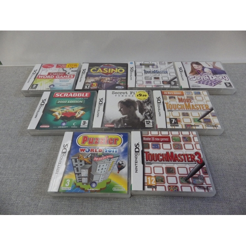 9023 - Two Nintendo DS Lites, one in a Brain training starter pack, along with a group on DS games includin... 