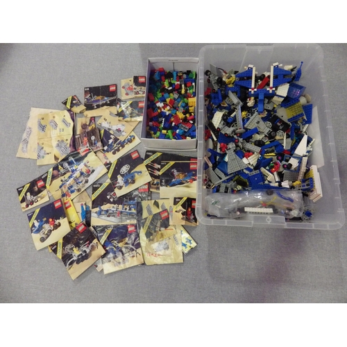 9258 - A box of LEGO containing mixed pieces, including mini figures, from various classic space series set... 