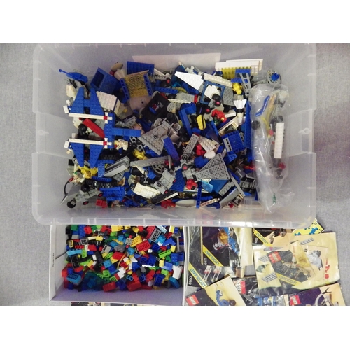 9258 - A box of LEGO containing mixed pieces, including mini figures, from various classic space series set... 