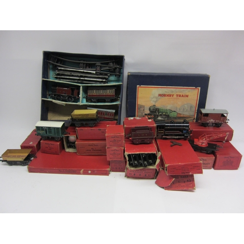 9499 - A collection of boxed Horby 0 gauge tinplate locomotives, rolling stock, track and accessories. To i... 