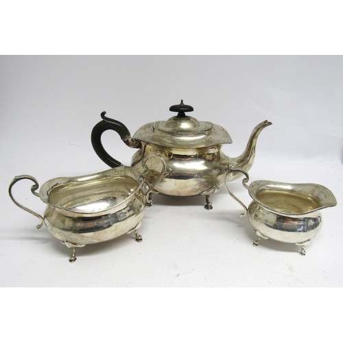 7452 - A Stewart Dawson & Co Ltd silver three piece teaset, teapot, scroll handle, hoof feet, 16cm tall x 2... 