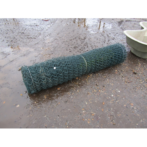 3272 - A roll of plastic coated link fencing