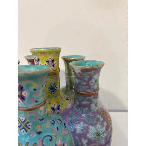 7448 - A pair of Oriental tulip vases in multicolour ground and foliate decoration, marks to base