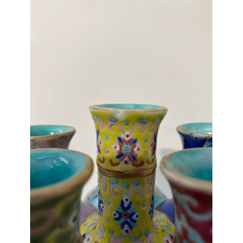 7448 - A pair of Oriental tulip vases in multicolour ground and foliate decoration, marks to base