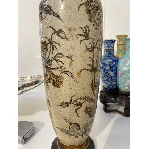 7446 - A pair of Martin Brothers stoneware vases of tall slender form, incised with birds and insects in fl... 