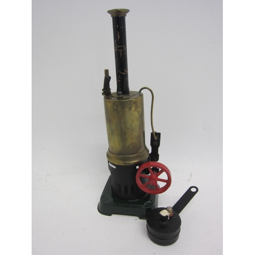 9546 - A Bing live steam stationary engine, green painted tinplate base with brass vertical boiler with chi... 