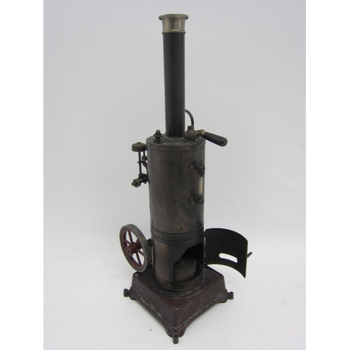 9554 - A Bing style stationary engine, maroon painted cast iron base with vertical boiler with chimney, pow... 