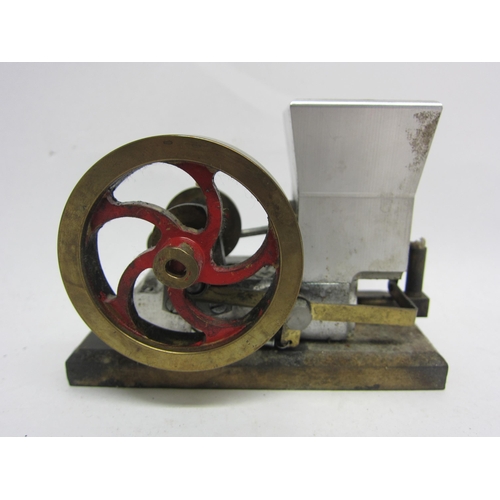 9544 - A small hot air stationary engine with single cylinder and polished brass flywheel on wooden base, 9... 